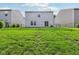 Grassy backyard between neighboring houses, showing the rear of the home at 1936 Southernwood Ln, Indianapolis, IN 46231