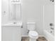 Clean bathroom with a vanity, toilet, and shower-tub combination with tile surround at 1936 Southernwood Ln, Indianapolis, IN 46231