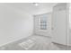 Bright bedroom featuring neutral carpet and paint and a window with blinds at 1936 Southernwood Ln, Indianapolis, IN 46231