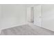 Minimalist bedroom featuring soft carpet and an open doorway to the next room at 1936 Southernwood Ln, Indianapolis, IN 46231