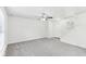 Bright living room with staircase, neutral paint, and ceiling fan at 1936 Southernwood Ln, Indianapolis, IN 46231