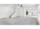 Bright open-concept living room and staircase featuring neutral paint and flooring at 1936 Southernwood Ln, Indianapolis, IN 46231