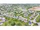 Expansive aerial perspective showcasing the neighborhood layout with ponds, green spaces, and nearby construction at 19534 Forsythe Dr, Noblesville, IN 46060