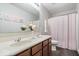 Bright bathroom featuring a double sink vanity and pink patterned shower curtain at 19534 Forsythe Dr, Noblesville, IN 46060