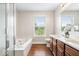 Relaxing bathroom with a soaking tub, separate shower, and double sink vanity at 19534 Forsythe Dr, Noblesville, IN 46060