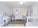 Adorable Bedroom with a rocking swan, a play area, and lavender color scheme at 19534 Forsythe Dr, Noblesville, IN 46060