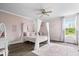 Bedroom featuring a canopy bed, and a light pink color scheme at 19534 Forsythe Dr, Noblesville, IN 46060