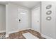 Bright foyer with wood floors, a white door, and modern decorative accents at 19534 Forsythe Dr, Noblesville, IN 46060