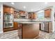 Spacious kitchen with wood cabinets, stainless steel appliances, and a large island at 19534 Forsythe Dr, Noblesville, IN 46060