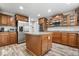 This is a kitchen with stainless steel appliances, an island, and wood cabinets at 19534 Forsythe Dr, Noblesville, IN 46060