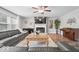 Inviting living room with a fireplace, piano, and comfortable seating area at 19534 Forsythe Dr, Noblesville, IN 46060