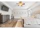 Spacious main bedroom with a tray ceiling, ceiling fan, and a chest of drawers at 19534 Forsythe Dr, Noblesville, IN 46060