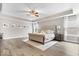 Spacious main bedroom with a tray ceiling, ceiling fan, and a decorative accent rug at 19534 Forsythe Dr, Noblesville, IN 46060