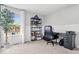 This office features built-in shelving, wainscoting, and ample light at 19534 Forsythe Dr, Noblesville, IN 46060