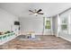 Spacious playroom featuring hardwood floors, a ceiling fan, and abundant natural light at 19534 Forsythe Dr, Noblesville, IN 46060