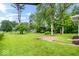 Spacious backyard featuring a well-manicured lawn and concrete patio, great for outdoor activities at 2105 Mayfair Dr, Indianapolis, IN 46260