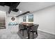Basement recreational area featuring game table and comfortable lounge seating at 2105 Mayfair Dr, Indianapolis, IN 46260