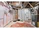 Exposed basement featuring unfinished walls, concrete flooring, and visible utility systems at 2105 Mayfair Dr, Indianapolis, IN 46260