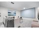 Entertainment area with large projector screen and comfortable seating in a finished basement at 2105 Mayfair Dr, Indianapolis, IN 46260