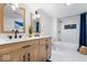 Stylish bathroom with dual vanity, modern fixtures, and glass shower door at 2105 Mayfair Dr, Indianapolis, IN 46260