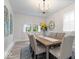 Beautiful dining room featuring hardwood floors, chandelier, and natural light at 2105 Mayfair Dr, Indianapolis, IN 46260