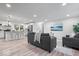 Open-concept living area with kitchen view, modern decor, and plenty of natural light at 2105 Mayfair Dr, Indianapolis, IN 46260