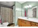 This bathroom has a wooden vanity and a shower at 241 Liberty Blvd, Mooresville, IN 46158