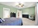 This bedroom features a ceiling fan, two dressers and a comfortable chair at 241 Liberty Blvd, Mooresville, IN 46158