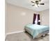 This bedroom features a bed, curtains, and is brightly illuminated by a ceiling fan at 241 Liberty Blvd, Mooresville, IN 46158