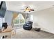 This bedroom has a chair, table, guitar and large window with natural light at 241 Liberty Blvd, Mooresville, IN 46158