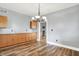 Dining room featuring hardwood floors, built-in cabinets, and modern lighting at 241 Liberty Blvd, Mooresville, IN 46158