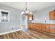 Bright dining room with wood floors, built-in cabinets, and a modern chandelier at 241 Liberty Blvd, Mooresville, IN 46158
