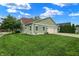 Charming home with green siding, a well-manicured lawn, and an attached three car garage at 241 Liberty Blvd, Mooresville, IN 46158