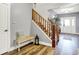 Inviting foyer with hardwood floors, staircase, and a view of the front door at 241 Liberty Blvd, Mooresville, IN 46158