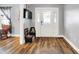 Bright foyer featuring hardwood floors and a white front door with decorative glass at 241 Liberty Blvd, Mooresville, IN 46158