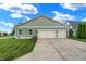 Attached three car garage with green siding and a concrete driveway at 241 Liberty Blvd, Mooresville, IN 46158