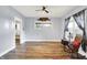 Inviting living room with hardwood floors, ceiling fan, and a comfortable rocking chair at 241 Liberty Blvd, Mooresville, IN 46158