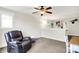 This living room has a comfortable leather recliner and plenty of natural light at 241 Liberty Blvd, Mooresville, IN 46158