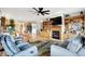Open concept living space with fireplace, kitchen, wood floors and comfortable seating at 241 Liberty Blvd, Mooresville, IN 46158