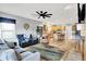 Open living space showcasing wood-style floors, comfortable seating, and views into the kitchen area at 241 Liberty Blvd, Mooresville, IN 46158