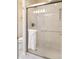 Bathroom features a large glass enclosed shower and a white towel at 2445 N Delaware St, Indianapolis, IN 46205