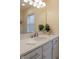 Bathroom features a white quartz countertop, a modern faucet, and a large mirror at 2445 N Delaware St, Indianapolis, IN 46205