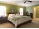 Spacious bedroom with natural light, carpet, and a ceiling fan at 2445 N Delaware St, Indianapolis, IN 46205