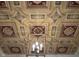 Ornate ceiling with decorative molding and a stylish light fixture, showcasing elegant architectural details at 2445 N Delaware St, Indianapolis, IN 46205
