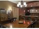 Dining room with unique lighting fixtures, bar and wooden table at 2445 N Delaware St, Indianapolis, IN 46205