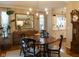 Charming dining room with hardwood floors, chandelier, and adjacent kitchen at 2445 N Delaware St, Indianapolis, IN 46205