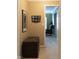 Hallway with neutral walls featuring decorations and a wooden chest at 2445 N Delaware St, Indianapolis, IN 46205