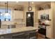 Bright, modern kitchen with white cabinets, granite countertops, stainless steel appliances, and an island at 2445 N Delaware St, Indianapolis, IN 46205