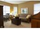 Bright living room with futon and large windows at 2445 N Delaware St, Indianapolis, IN 46205
