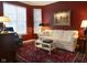 Cozy living room with a comfortable white sofa, a patterned rug, and classic decor at 2445 N Delaware St, Indianapolis, IN 46205